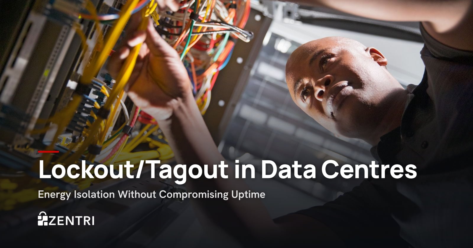 Technician checking cables inside a data centre server rack