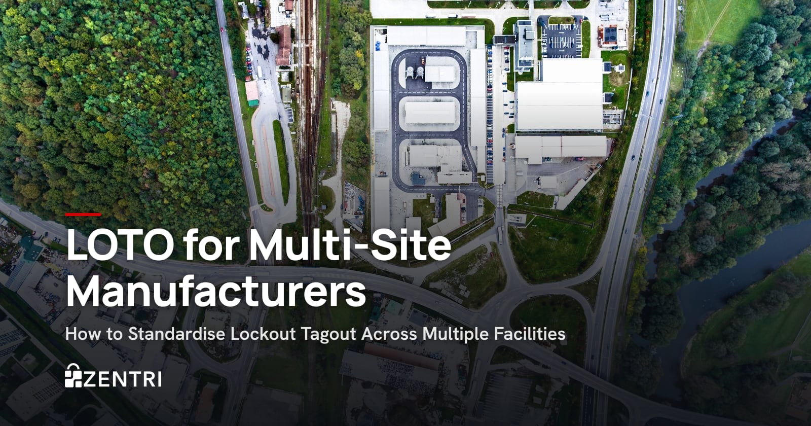 Aerial view of industrial buildings surrounded by forest